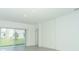 Open living room featuring sliding glass doors that let in natural light at 471 Wayland Dr, Haines City, FL 33844