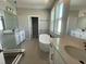Bright bathroom featuring a soaking tub, double vanity, and glass-enclosed shower at 5324 Center Lake Ranch Blvd, St Cloud, FL 34771