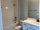 Modern bathroom featuring white subway tile, a tub, and white vanity with a black faucet at 5324 Center Lake Ranch Blvd, St Cloud, FL 34771