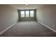 Spacious carpeted bedroom featuring a window view of the neighborhood with ample natural light at 5324 Center Lake Ranch Blvd, St Cloud, FL 34771