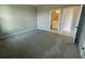 Open bedroom featuring neutral carpet and an open door to the bathroom at 5324 Center Lake Ranch Blvd, St Cloud, FL 34771