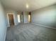 A carpeted main bedroom includes a walk-in closet, a separate bathroom, and neutral tones at 5324 Center Lake Ranch Blvd, St Cloud, FL 34771