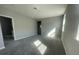 Neutral bedroom features carpet, natural light from the windows and a walk-in closet with an adjoining bathroom at 5324 Center Lake Ranch Blvd, St Cloud, FL 34771