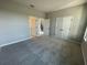 Spacious bedroom with neutral carpet and two closets, and a view of the staircase at 5324 Center Lake Ranch Blvd, St Cloud, FL 34771