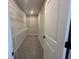 Walk-in closet is equipped with wire shelving units and carpeted floors at 5324 Center Lake Ranch Blvd, St Cloud, FL 34771