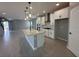 Modern kitchen featuring a large island, stainless steel appliances, and sleek white cabinetry at 5324 Center Lake Ranch Blvd, St Cloud, FL 34771