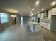 Bright living room with a view into the kitchen, showcasing the open floor plan and modern finishes at 5324 Center Lake Ranch Blvd, St Cloud, FL 34771