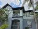 Close up view of a two-story condo building with balconies, showcasing the architectural details and outdoor living space at 5501 Pga Blvd # 4723, Orlando, FL 32839