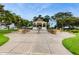 Gazebo with a walkway, surrounded by lush green landscaping and mature trees at 579 Setting Sun Dr, Winter Garden, FL 34787