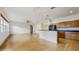 Spacious living area with a partial wall overlooking the kitchen, creating an open flow between living spaces at 579 Setting Sun Dr, Winter Garden, FL 34787