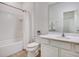Pristine bathroom featuring a shower-tub combo, a toilet, and a sleek vanity at 6112 Broad Oak Dr, Davenport, FL 33837