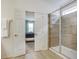 En-suite bathroom with a glass-enclosed shower and a view into a bedroom at 6112 Broad Oak Dr, Davenport, FL 33837