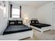 Bright bedroom offers two twin beds with Star Wars themed bedding and decor, with a neutral carpet at 6112 Broad Oak Dr, Davenport, FL 33837