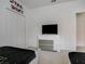 Bright bedroom features twin beds with Star Wars bedding, a dresser with a TV, and carpet floors at 6112 Broad Oak Dr, Davenport, FL 33837