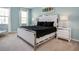 Chic bedroom boasts a stylish bed, matching nightstands, and bright natural light at 6112 Broad Oak Dr, Davenport, FL 33837