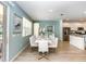 Open-concept dining area with a large table, seating for ten, and stylish decor at 6112 Broad Oak Dr, Davenport, FL 33837