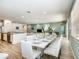 Spacious open-concept living and dining area with a modern aesthetic, perfect for entertaining at 6112 Broad Oak Dr, Davenport, FL 33837