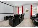 Home movie theater with seating, large screen, and clean, modern design at 6112 Broad Oak Dr, Davenport, FL 33837