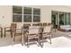 Covered lanai with outdoor dining table and seating at 6112 Broad Oak Dr, Davenport, FL 33837
