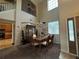Dining area next to the kitchen, featuring a modern chandelier and staircase in view at 6224 Zane Dr, Mount Dora, FL 32757