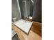 Modern bathroom featuring natural wood countertop with vessel sink and waterfall faucet at 7727 Glynde Hill Dr, Orlando, FL 32835