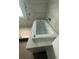 Modern bathtub featuring jets, stylish tile, and a handheld shower head at 7727 Glynde Hill Dr, Orlando, FL 32835