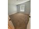 Cozy bedroom with neutral walls, carpeting, and window, creating a serene and comfortable atmosphere at 7727 Glynde Hill Dr, Orlando, FL 32835