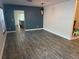 Open dining area boasts modern light fixture, neutral paint and flooring, and kitchen view at 7727 Glynde Hill Dr, Orlando, FL 32835