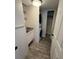 Functional laundry room features storage shelves, sink, and stacked washer and dryer at 7727 Glynde Hill Dr, Orlando, FL 32835