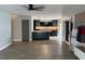 Open-concept layout showing seamless integration of the kitchen island and the living room, enhancing everyday living at 7727 Glynde Hill Dr, Orlando, FL 32835