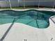 The backyard pool is surrounded by white fencing and lush greenery at 7727 Glynde Hill Dr, Orlando, FL 32835