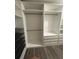 Organized walk-in closet showcasing hanging rods, drawers, and shelves for optimal storage solutions at 7727 Glynde Hill Dr, Orlando, FL 32835