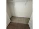 Standard walk-in closet features wire shelving providing plenty of storage for clothes and accessories at 7727 Glynde Hill Dr, Orlando, FL 32835