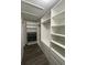 Spacious walk-in closet offering ample storage with custom shelving and drawer systems at 7727 Glynde Hill Dr, Orlando, FL 32835