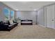 The bonus room has plenty of room for relaxation and fun, filled with natural light from a large window at 8047 Chilton Dr, Orlando, FL 32836