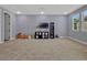 The expansive bonus room offers versatile space, and is ready to be used as an office, playroom or media room at 8047 Chilton Dr, Orlando, FL 32836