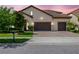 Charming single-story home with a terracotta roof, lush landscaping, and a spacious three-car garage at 8047 Chilton Dr, Orlando, FL 32836
