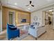 Bright living room featuring a wood accent wall with modern lighting, and stylish furnishings at 8047 Chilton Dr, Orlando, FL 32836