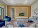 Modern living room features stylish decor, comfortable seating, and a sleek media wall creating an inviting space at 8047 Chilton Dr, Orlando, FL 32836