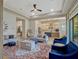 Open-concept living room showcasing modern decor, light wood floors and seamless flow to the kitchen at 8047 Chilton Dr, Orlando, FL 32836
