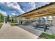 Covered picnic area with tables and seating beside the playground, perfect for community gatherings at 8047 Chilton Dr, Orlando, FL 32836