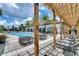 Beautiful community pool with relaxing lounge chairs and covered patio for enjoying time outdoors at 8047 Chilton Dr, Orlando, FL 32836