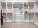 Spacious walk-in closet with custom shelving, drawers, and ample storage space for clothes and accessories at 8047 Chilton Dr, Orlando, FL 32836