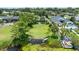 Aerial view of home with expansive yard, lake access, and a serene waterfront lifestyle at 8473 Granada Blvd, Orlando, FL 32836