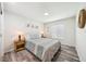 Comfortable bedroom with wood floors, matching nightstands, and natural light from a window at 8473 Granada Blvd, Orlando, FL 32836