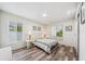 Bright bedroom with two windows providing ample natural light and wood flooring at 8473 Granada Blvd, Orlando, FL 32836