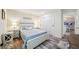 Well-lit bedroom with white sliding barn door closet and view to the living area at 8473 Granada Blvd, Orlando, FL 32836
