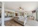 Sunroom with tile floors, comfortable seating, and views of the lake and backyard at 8473 Granada Blvd, Orlando, FL 32836