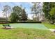 Community basketball court surrounded by lush greenery, perfect for recreational activities at 8704 Ingleton Ct, Orlando, FL 32836