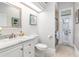 A bathroom with a white vanity with a marble countertop and a stand up shower at 8704 Ingleton Ct, Orlando, FL 32836
